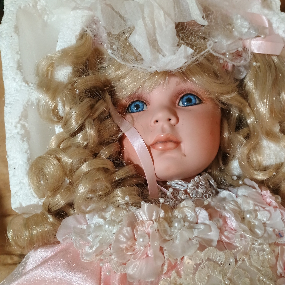 Porcelain Doll with Blonde Curls and Pink Dress